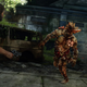 A bloater is seen charging at Joel in a dilapidated building.